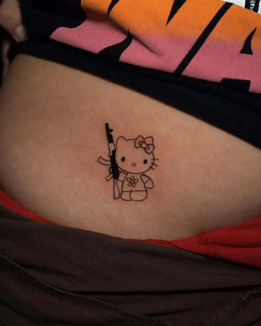 Small Linework Hello Kitty with Gun on Women Abdomen Tattoo by @sal.tatt