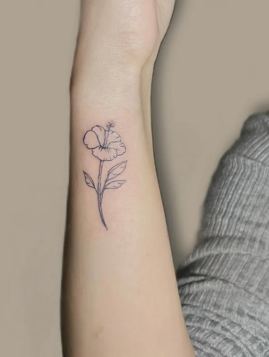 Small Linework Hibiscus Flower on Women Wrist Flower Tattoo by @tatt.elena