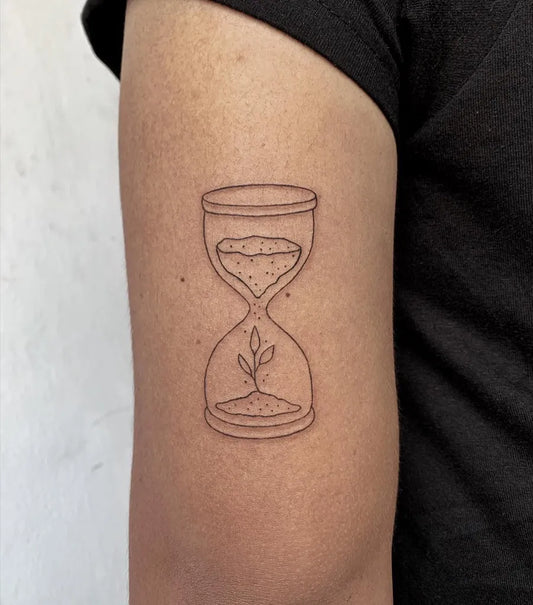 Small Linework Hourglass With Sprout Tattoo on Women Arm by @actysuntattoo