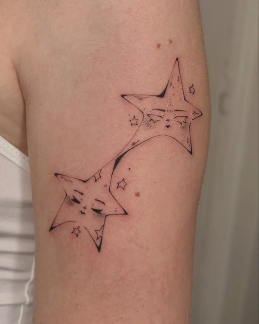 Small Linework Human Star Tattoo on Women Upper Arm by @nebbercracker.ttt