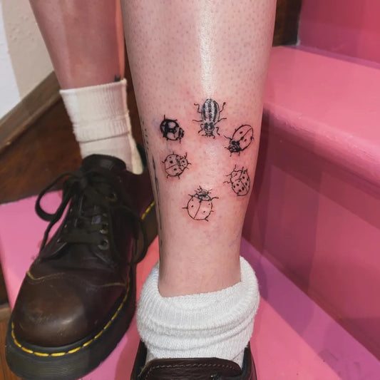 Small Linework Ladybug and Beetle Tattoo on Women Leg by @oxalis_______