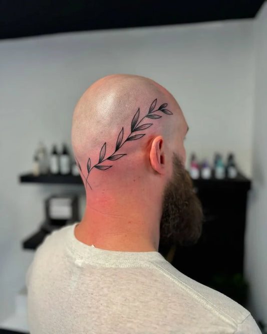 Small Linework Laurel Wreath Tattoo on Men Head by @jordy_lenaerts_tattoo