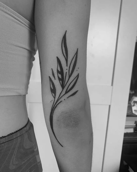 Small Linework Leaf Branch Tattoo on Women Elbow by @janky_studios