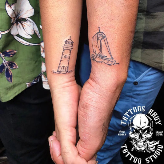 Small Linework Lighthouse and Sailboat Tattoo on Women Wrist by @tattoos_ahoy