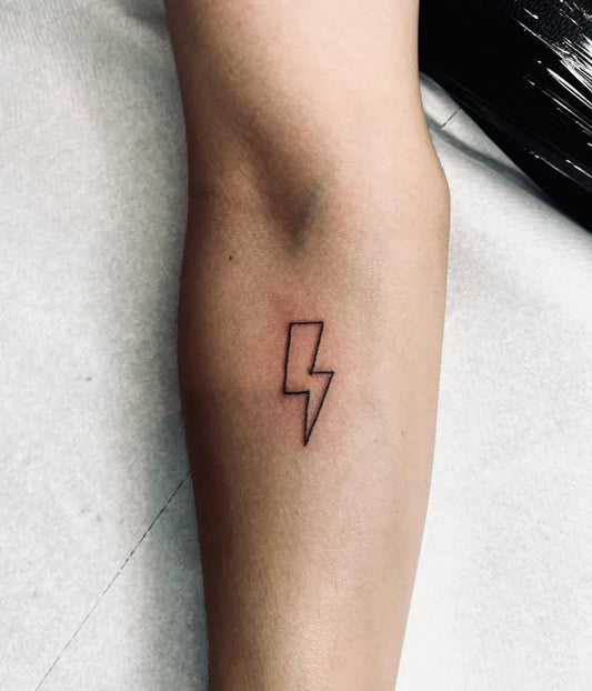 Small Linework Lightning Bolt Tattoo on Women Forearm by @not3bad_tattoos