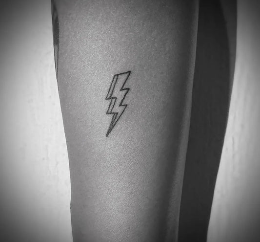 Small Linework Lightning Bolt Tattoo on Women Leg by @paimon311