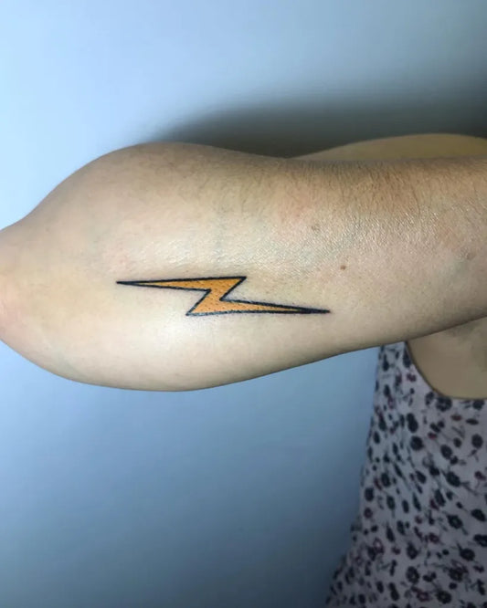 Small Linework Lightning Bolt Tattoo on Women Upper Arm by @fuzo_trt