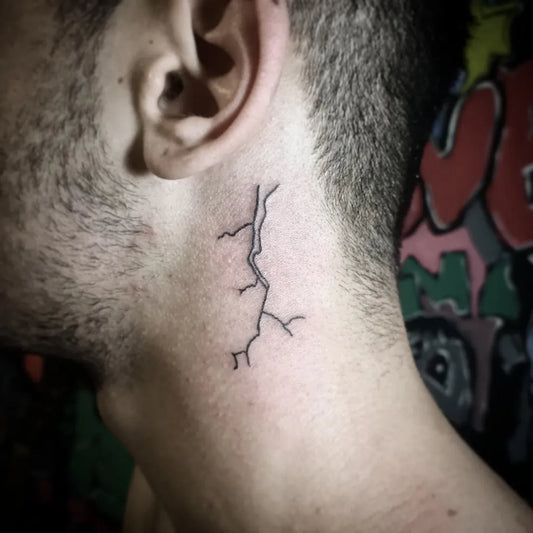 Small Linework Lightning Tattoo on Men Behind Ear by @alien_tattoo_ink
