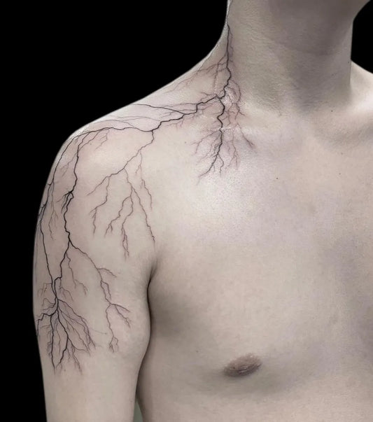 Small Linework Lightning Tattoo on Men Shoulder by @outerlimitstattoo