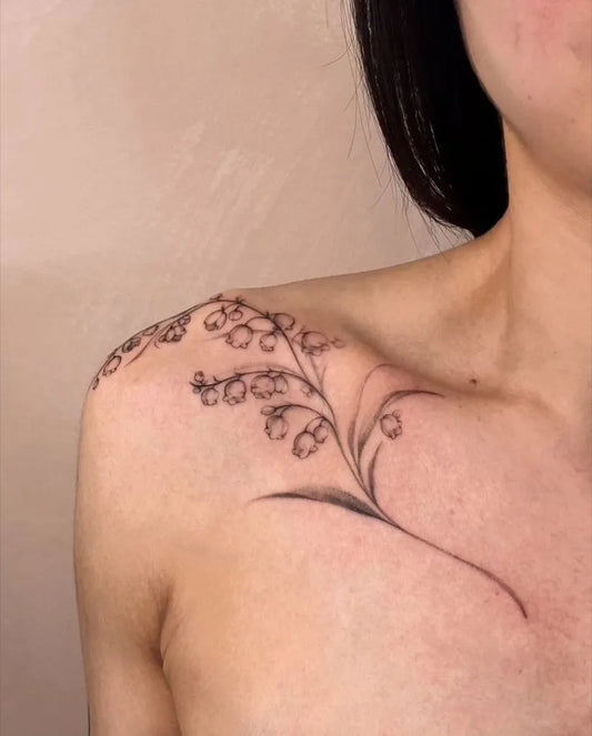 Small Linework Lily of the Valley Women Shoulder Tattoo by @chronicink_vancouver