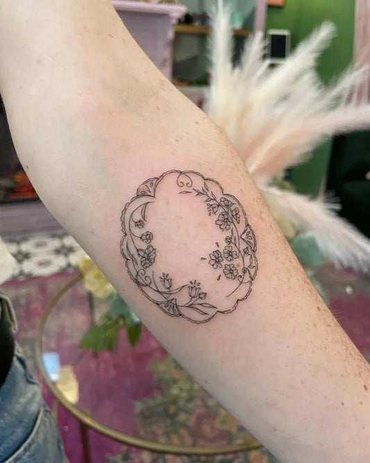 Small Linework Lily of the Valley Wreath on Women Arm Tattoo by @mclametattoos
