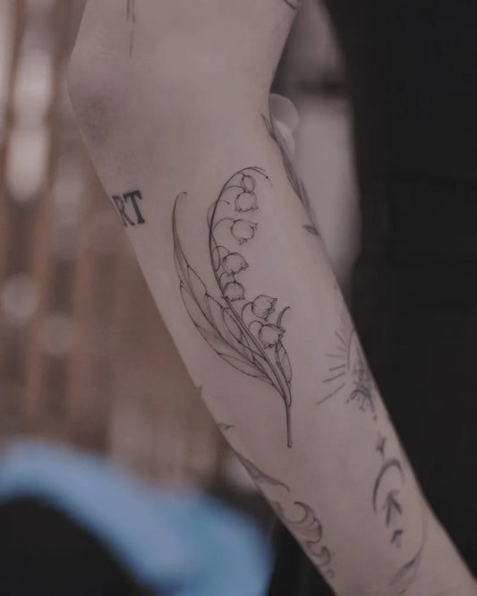 Small Linework Lily of the Valley and Branches on Women Arm Tattoo by @lavrapala