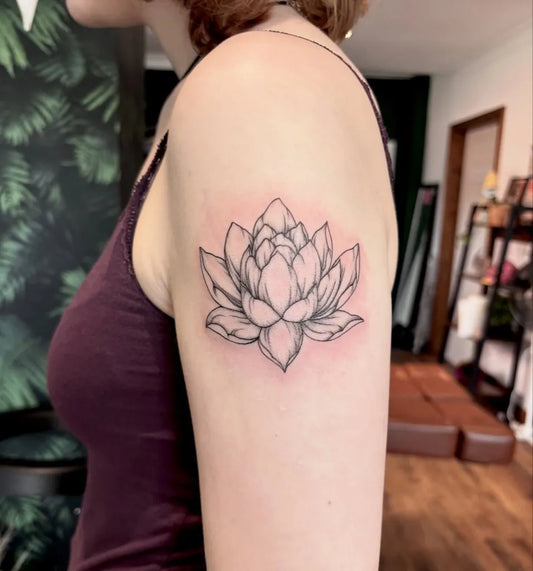 Small Linework Lotus Flower on Women Shoulder Tattoo by @plumkin.tattoo
