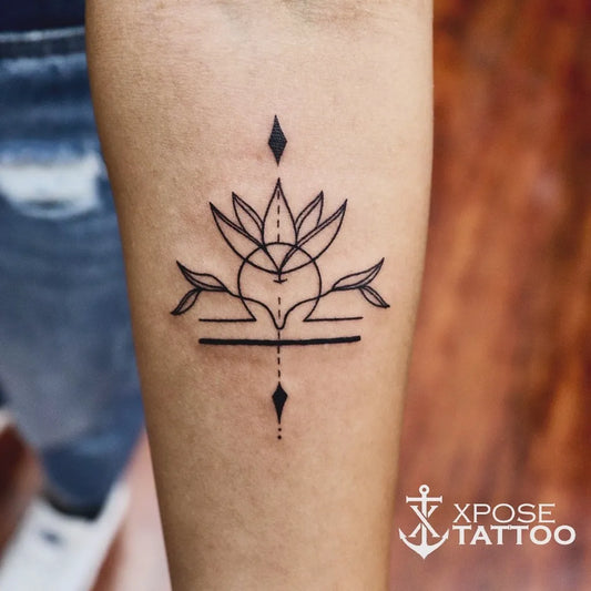 Small Linework Lotus Flower with Geometric Elements on Women Arm Tattoo by @xposetattoosjaipur