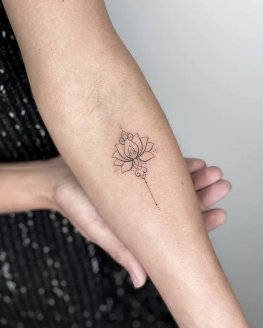 Small Linework Lotus Flower with Tassel on Women Arm Tattoo by @jasminwalshtattoo