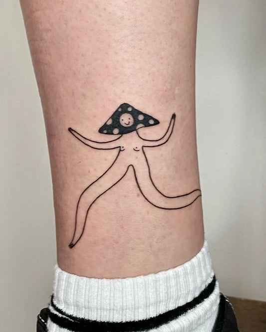 Small Linework Mushroom Figure on Women Leg Tattoo by @baba_ada_