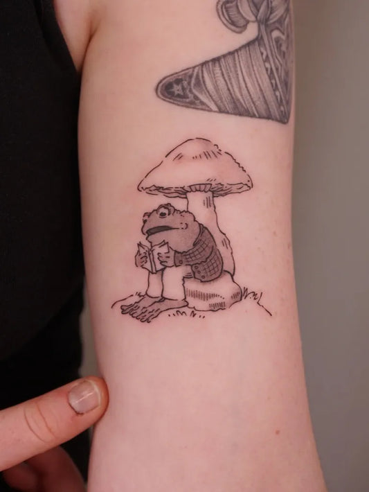 Small Linework Mushroom and Frog on Women Arm Tattoo by @xiaoxiao_ink