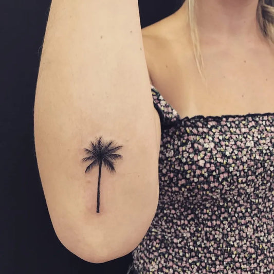 Small Linework Palm Tree Tattoo on Women Arm by @lucasbmsoares
