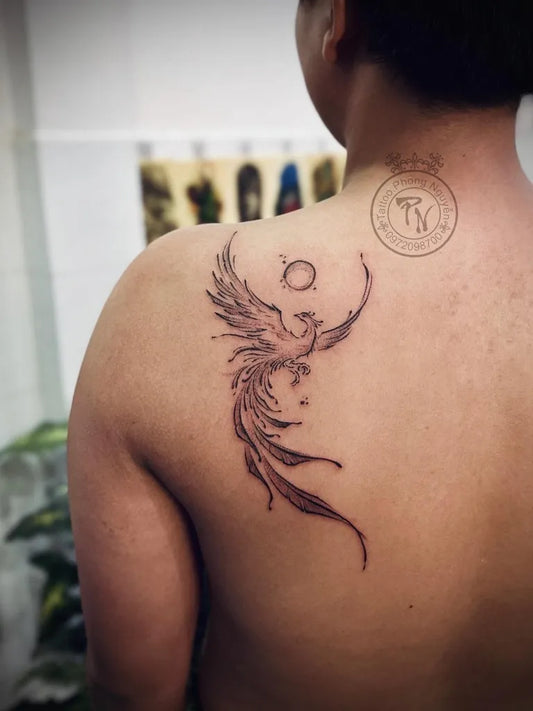 Small Linework Phoenix and Moon on Women Shoulder Tattoo by @phongnguyentattoo