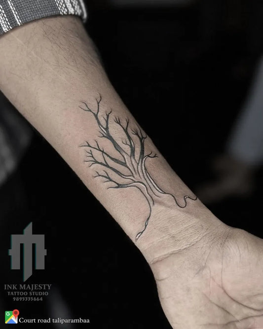 Small Linework Poison Tree on Men Wrist Tattoo by @tattoo_ink_majesty_taliparamba