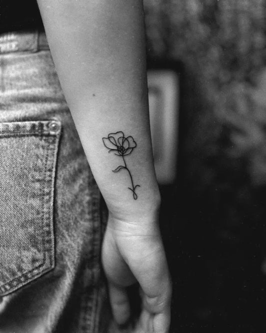 Small Linework Poppy on Women Wrist Tattoo by @leartistry_ink