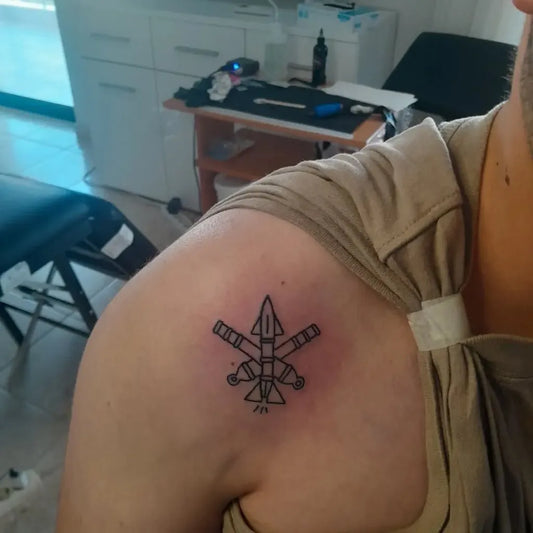 Small Linework Rocket Military Tattoo on Men Shoulder by @xristos.petratos.tattoo