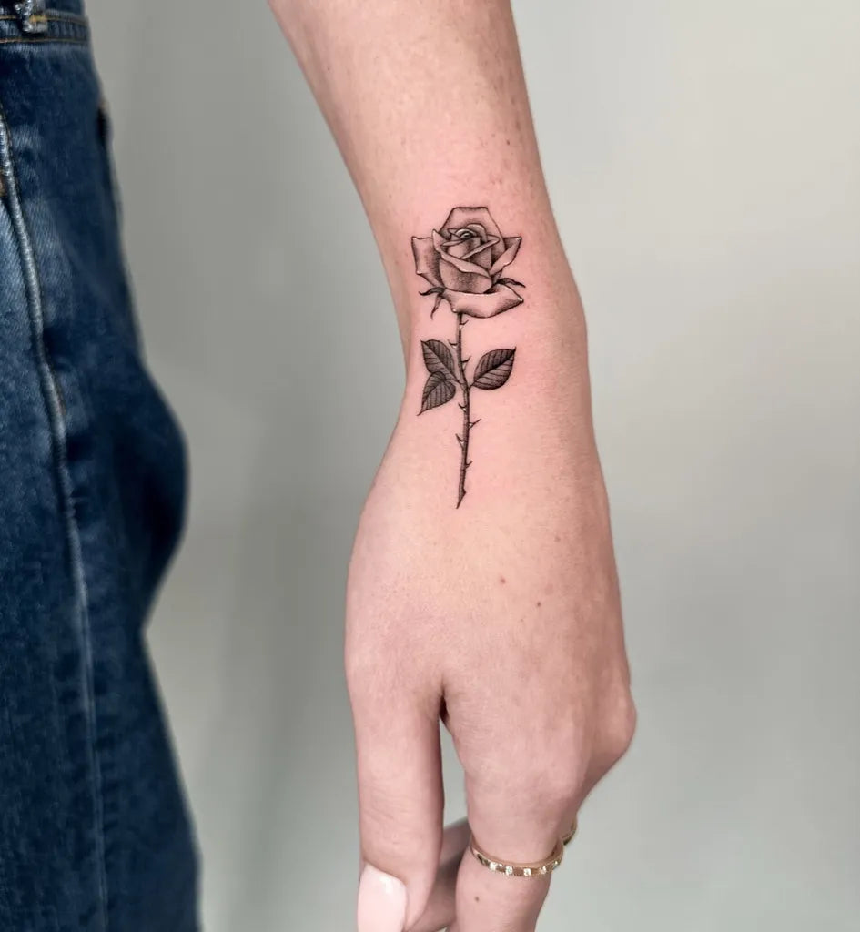 Small Linework Rose on Women Wrist Tattoo by @badmoodmarty