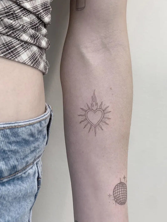 Small Linework Sacred Heart and Disco Ball on Women Forearm Tattoo by @micro_man_