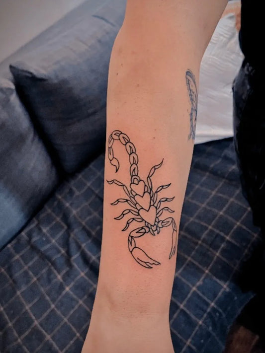 Small Linework Scorpion with Heart on Women Arm Tattoo by @tattoo_empire_jeddah