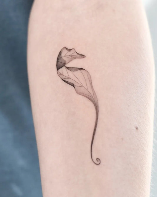 Small Linework Seahorse Tattoo on Women Arm by @eloula.tattoo