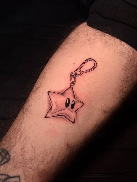 Small Linework Star Keychain Tattoo on Men Forearm by @drano_tattoo
