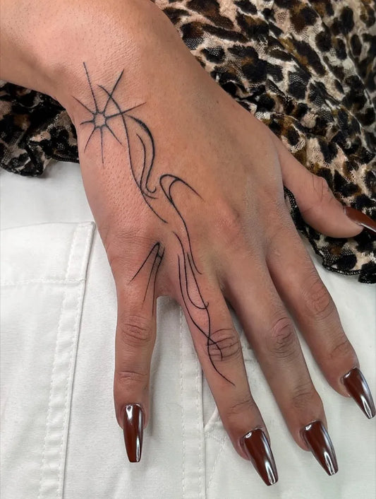 Small Linework Star and Flames on Women Wrist Tattoo by @sangredelcielo