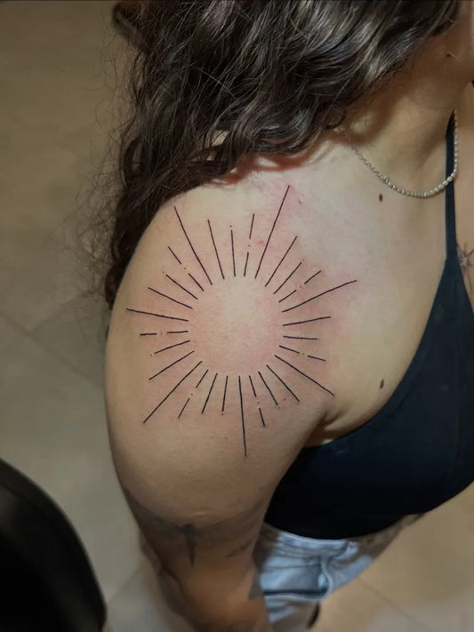 Small Linework Sun on Women Shoulder Tattoo by @dhandaratatuagem