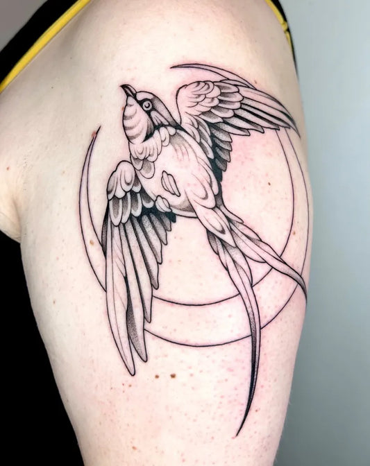 Small Linework Swallow and Moon Tattoo on Women Upper Arm by @carlavtattoos