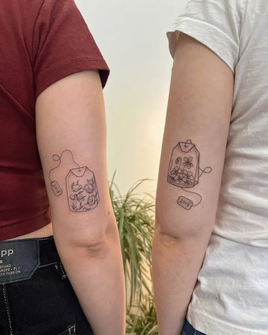 Small Linework Teabag on Friends Arm Matching Tattoo by @tragtattoo