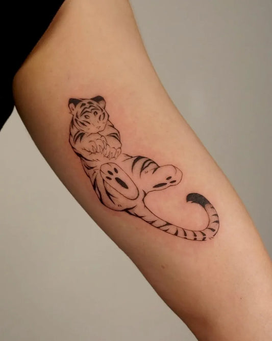 Small Linework Tiger on Women Arm Tattoo by @pierrotpokes
