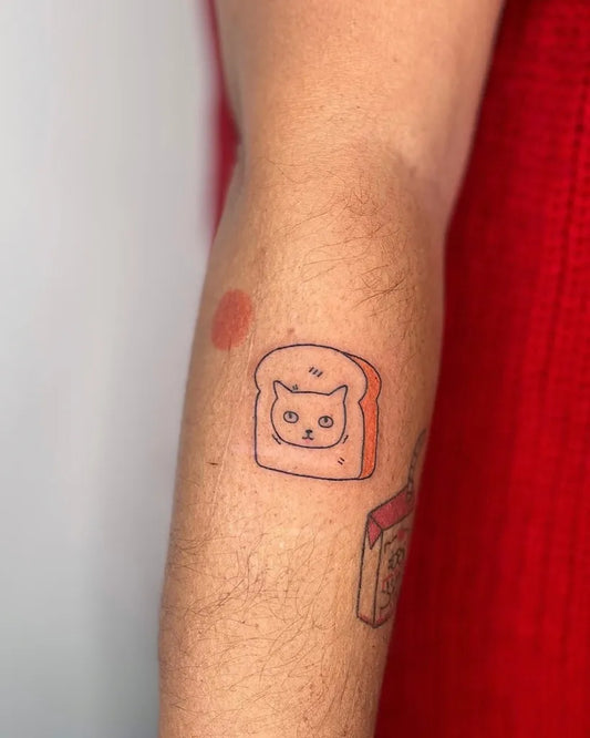 Small Linework Toast Cat on Women Arm Tattoo by @baby.asteroid