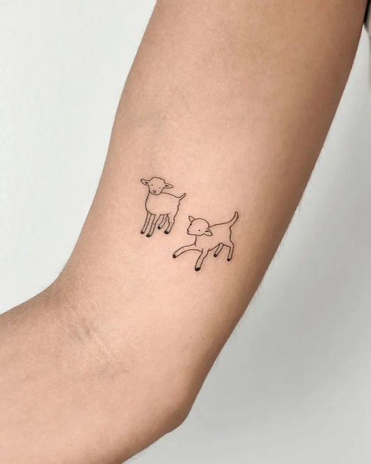 Small Linework Two Lambs on Women Arm Tattoo by @cha.tattoo