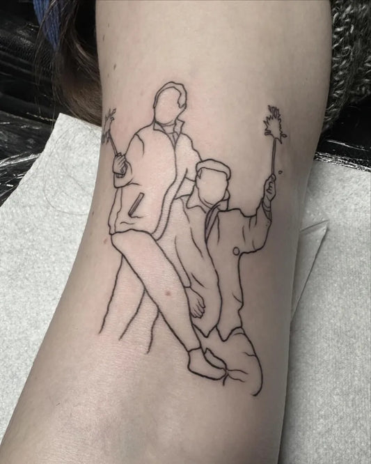 Small Linework Two Men Dancing on Women Arm Tattoo by @antclaytattoo