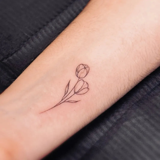 Small Linework Two Tulips Tattoo on Women Wrist by @elizatattooamsterdam