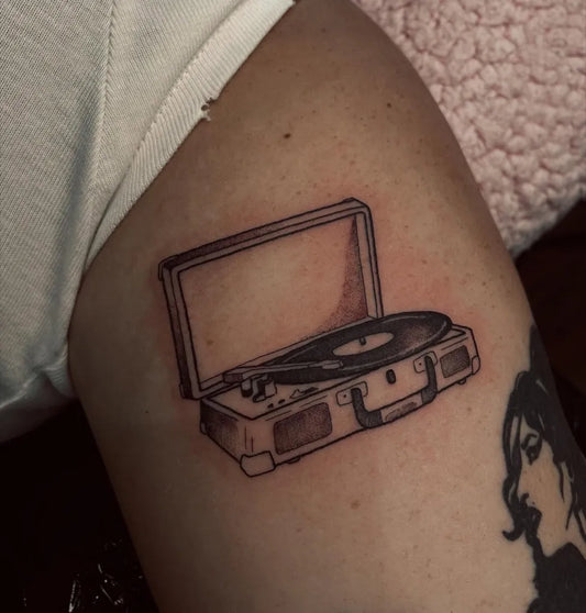 Small Linework Vinyl Record Player Music Tattoo on Women Arm by @lucyalextattoo