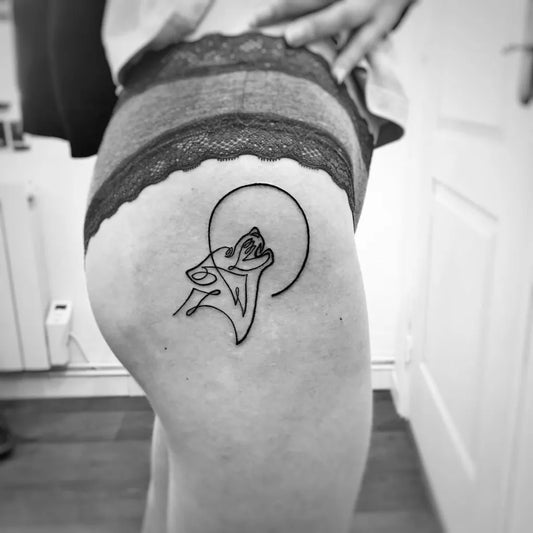 Small Linework Wolf Howling at Moon on Women Hip Tattoo by @rigalstudio