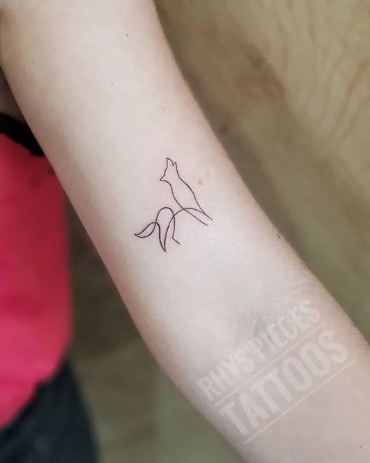Small Linework Wolf on Women Arm Tattoo by @rhyspiecestattoos