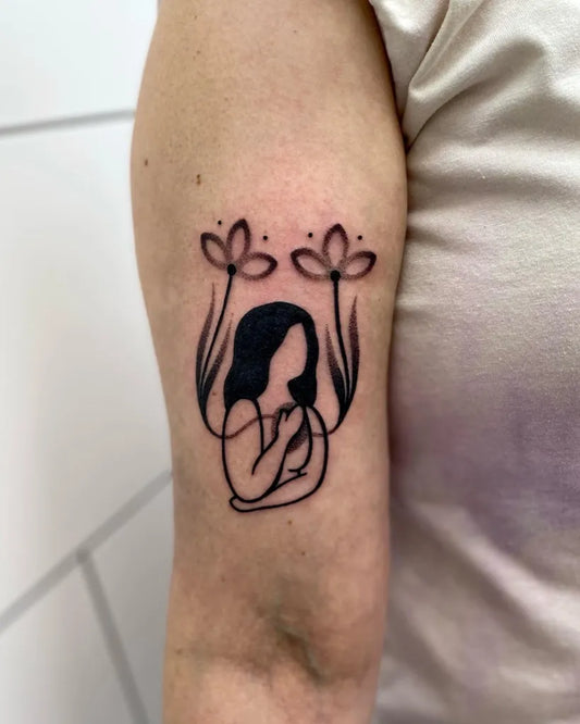 Small Linework Woman with Flowers Tattoo on Women Bicep by @maritdatter