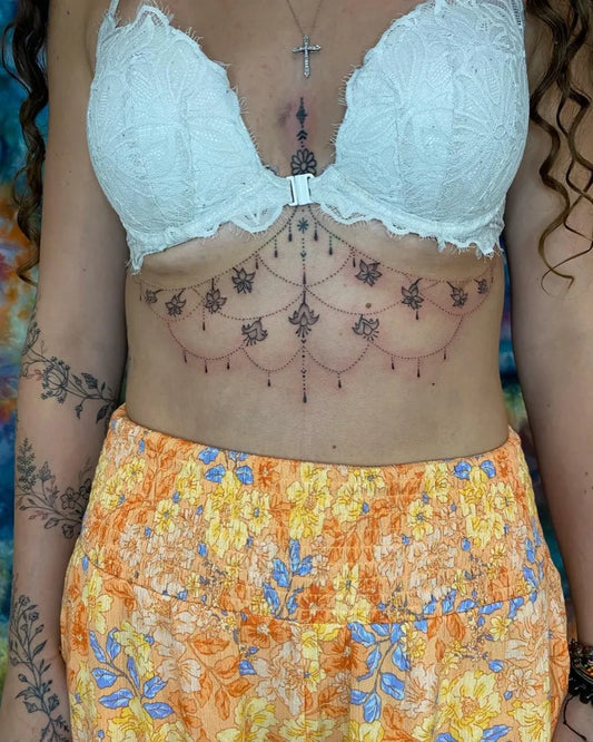Small Mandala Chandelier on Women Sternum Tattoo by @runaandbigfoot