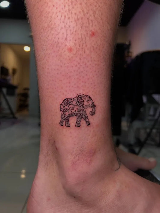 Small Mandala Elephant Tattoo on Men Ankle by @happyrain.tatt