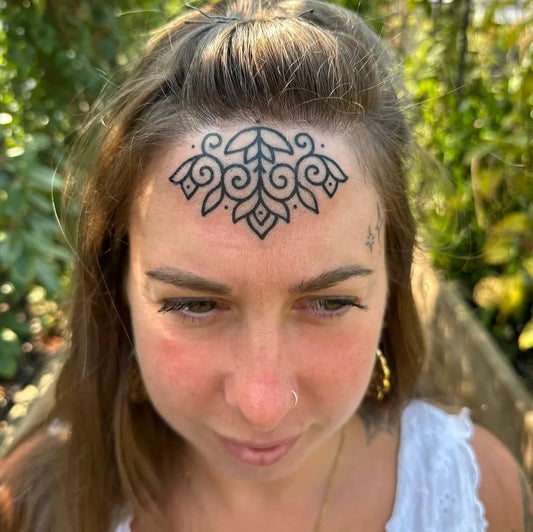 Small Mandala Floral on Women Face Tattoo by @darkmaa_tattooer