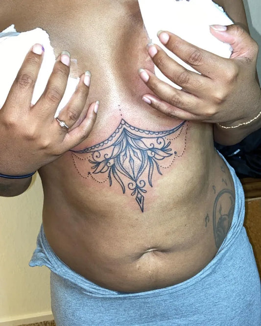 Small Mandala Flourish on Women Sternum Tattoo by @glizzs_visiion