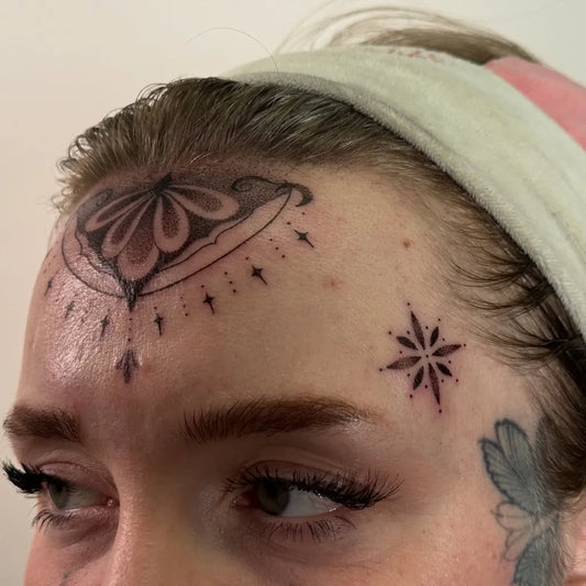 Small Mandala Flower Stars on Women Face Tattoo by @keirra.tattoos