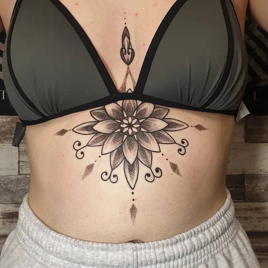 Small Mandala Flower on Women Sternum Tattoo by @dazansbrotattoo